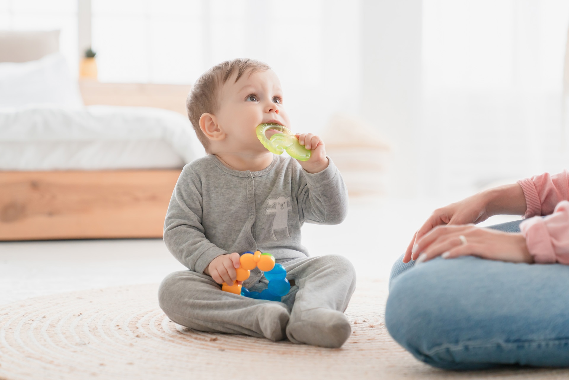 A toddler playing with a chewing toy A toddler playing with a chewing toy