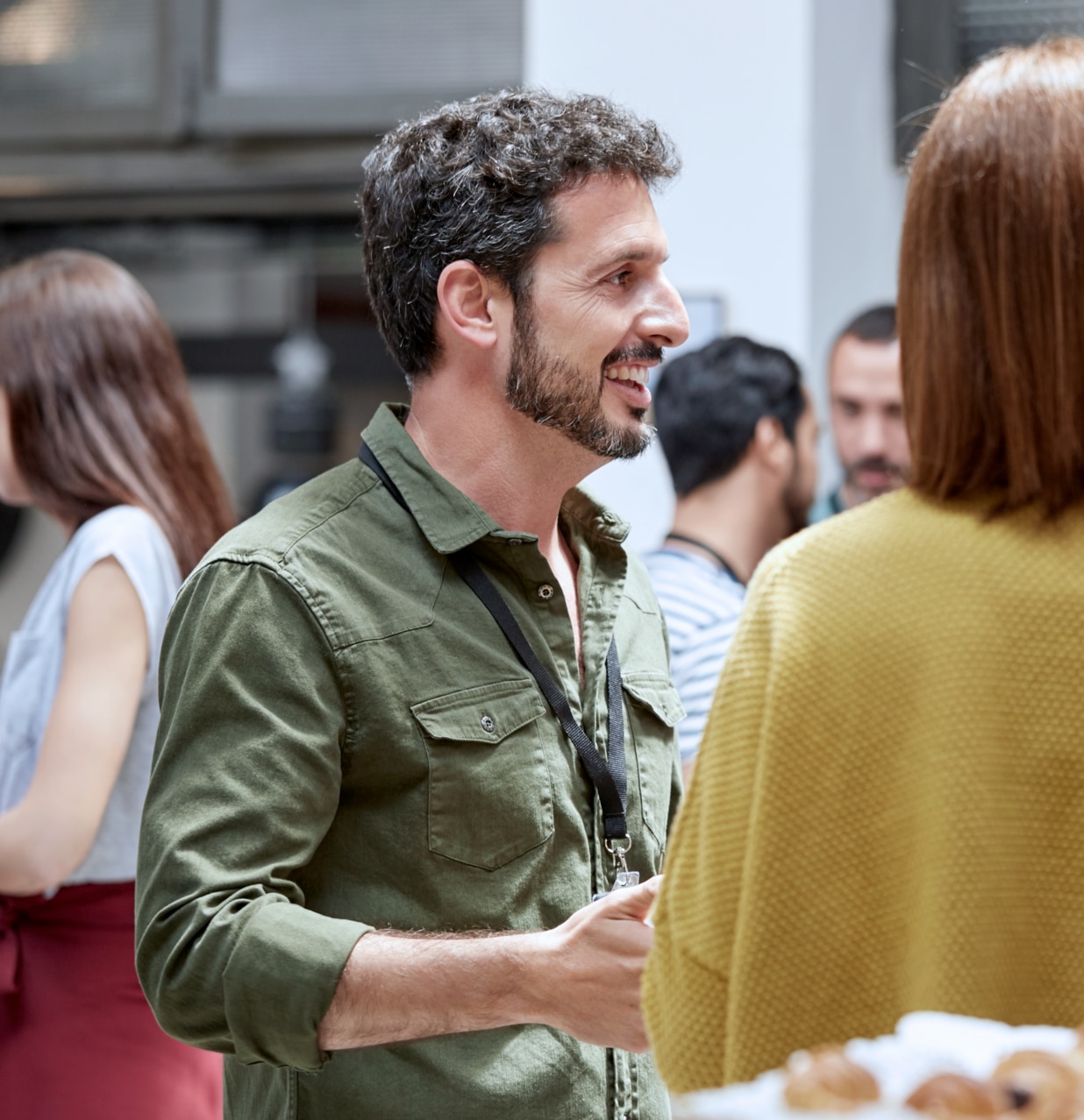 Group conversation during a party - middle-aged man is speaking.