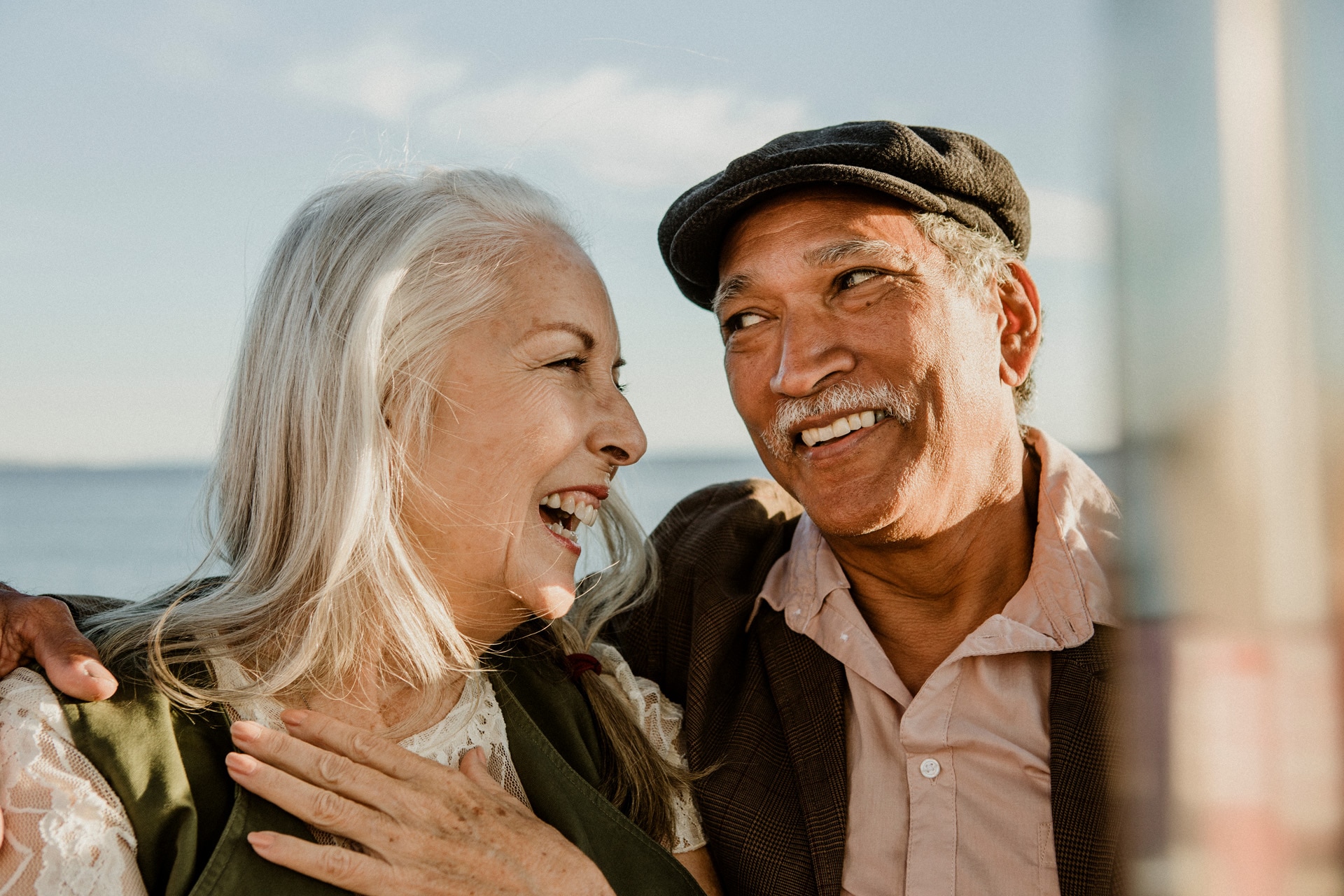 Cheerful senior couple enjoying a Ferris wheel by the Santa Monica pier