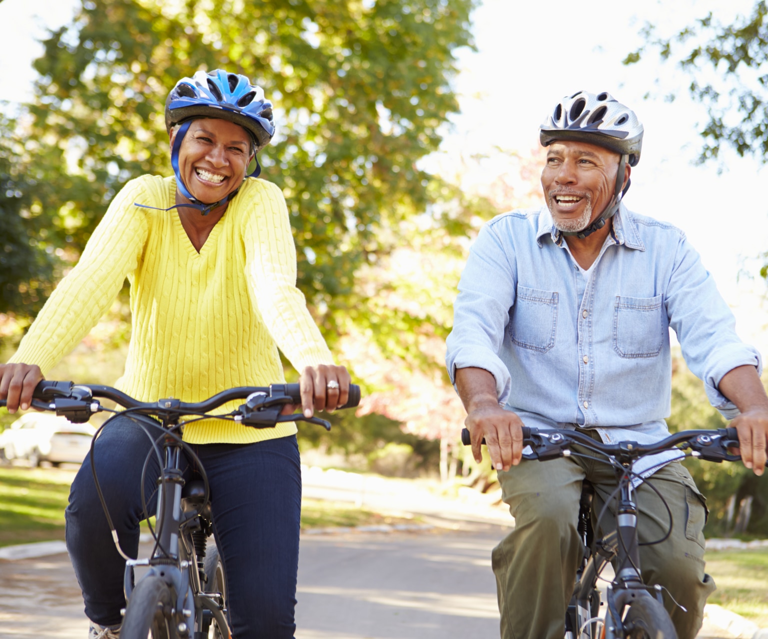 Senior Couple On Cycle Ride In Countryside