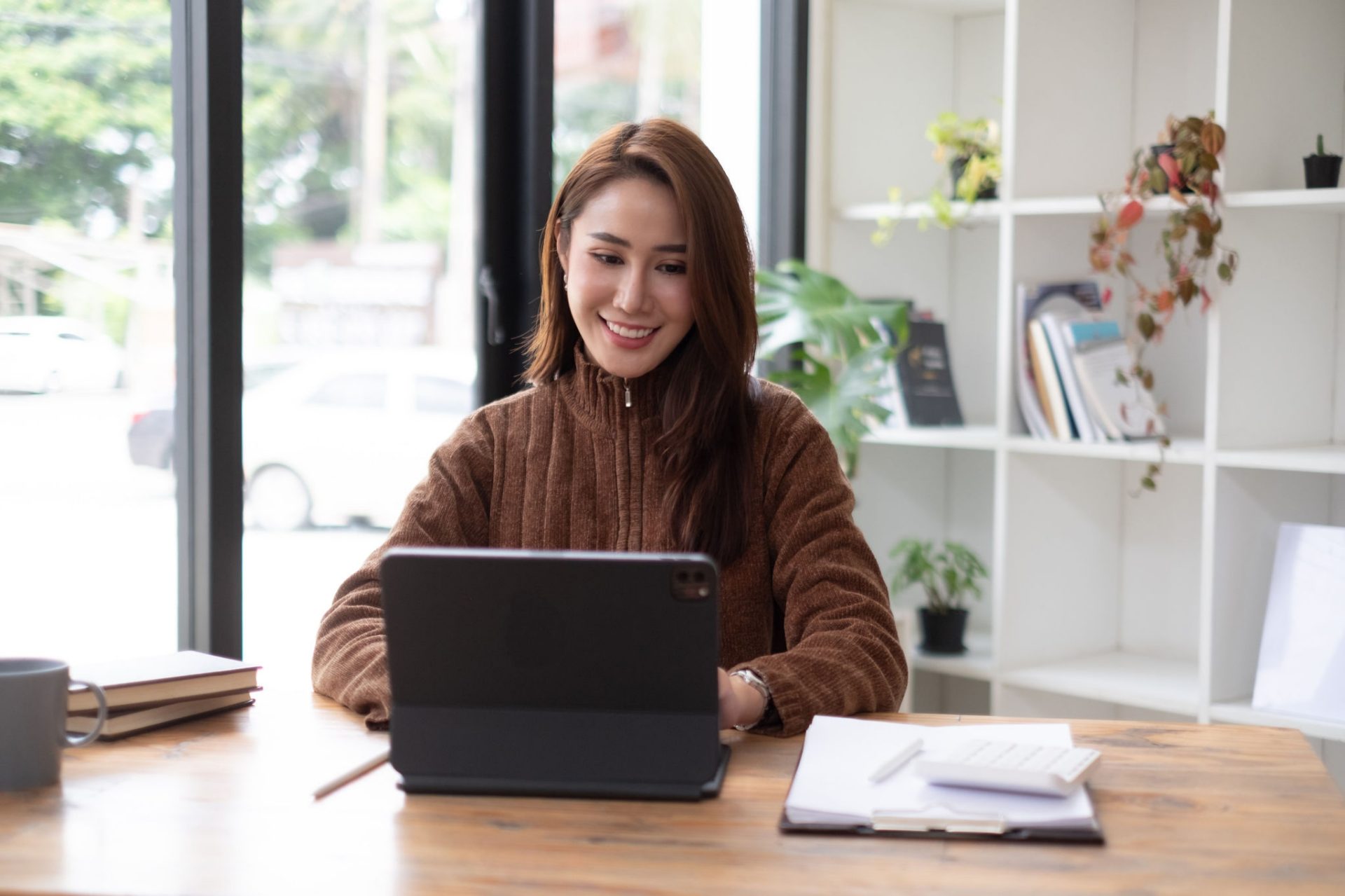 Shot of an attractive mature businesswoman working on laptop in her workstation.