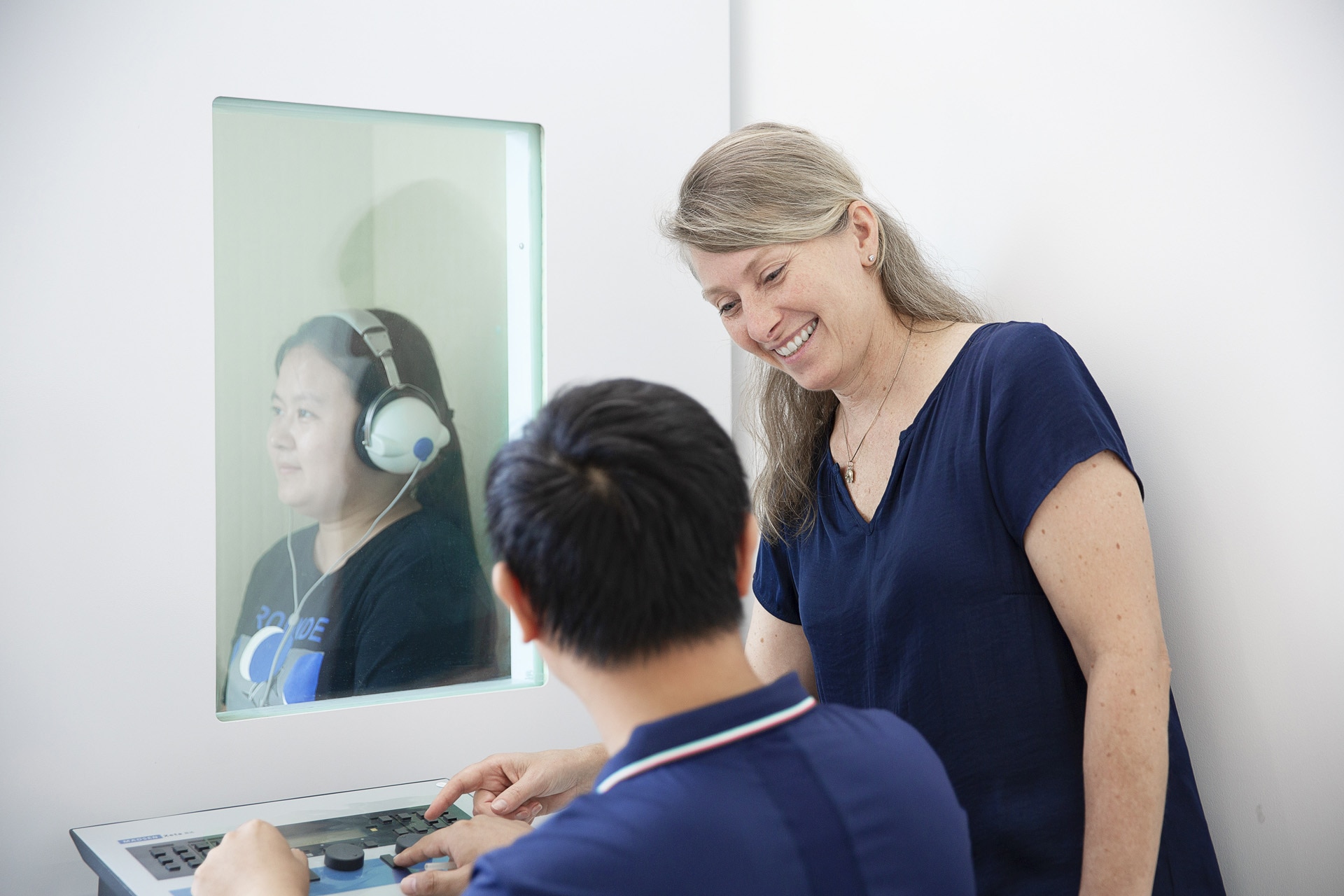 Hearing test performed in an audiologist's office.