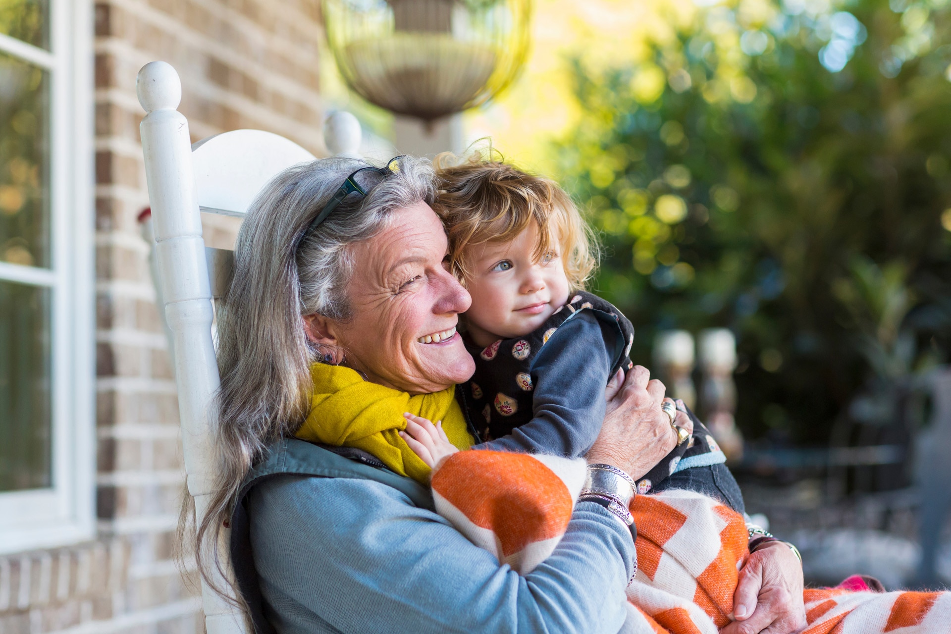 Grandmother and grandson sitting on porch. Grandmother and grandson sitting on porch.
